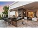 Outdoor kitchen and living space featuring a bar, fireplace, seating and elegant finishes at 5700 E Sanna St, Paradise Valley, AZ 85253