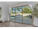 Sliding glass doors offer a view of the landscaped backyard with pool and seating at 5941 S Cambridge St, Chandler, AZ 85249