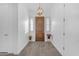 Bright foyer with elegant lighting, wood-look tile floors, and stylish decor, offering a welcoming first impression at 5941 S Cambridge St, Chandler, AZ 85249