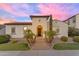 Beautiful home with mature landscaping and classic architecture, enhanced by a colorful sky at 5941 S Cambridge St, Chandler, AZ 85249