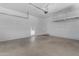 Spacious two-car garage with shelving and storage, ready for vehicles and projects at 5941 S Cambridge St, Chandler, AZ 85249