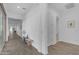 Bright, long hallway with modern finishes, leading to backyard patio doors and providing a sense of spaciousness at 5941 S Cambridge St, Chandler, AZ 85249