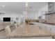 Spacious kitchen featuring granite countertops, an island with seating, and stainless steel appliances at 5941 S Cambridge St, Chandler, AZ 85249