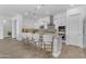 Kitchen island with bar seating and stainless steel appliances create an ideal space for entertaining at 5941 S Cambridge St, Chandler, AZ 85249