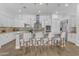 Open kitchen features an island with bar seating and modern stainless steel appliances at 5941 S Cambridge St, Chandler, AZ 85249