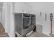 Well-equipped laundry area with a large washer, dryer, and ample storage space at 5941 S Cambridge St, Chandler, AZ 85249