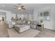 Bright living room features an open layout and comfortable sectional sofa for relaxing and entertaining at 5941 S Cambridge St, Chandler, AZ 85249
