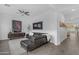 Cozy living room featuring a leather sofa, media center and elegant decor at 5941 S Cambridge St, Chandler, AZ 85249