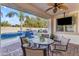 Covered patio with outdoor dining and a view of the pool, perfect for enjoying meals outdoors at 5941 S Cambridge St, Chandler, AZ 85249