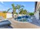Backyard pool featuring water features, palm trees, and lounge chairs for relaxation and leisure at 5941 S Cambridge St, Chandler, AZ 85249