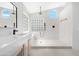 Modern bathroom featuring a walk-in shower with glass block window and rainfall shower head at 641 W Oriole Way, Chandler, AZ 85286