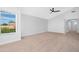 Bedroom featuring soft neutral carpet, ceiling fan and backyard view at 641 W Oriole Way, Chandler, AZ 85286