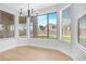 Dining area featuring a chandelier, large windows with blinds, offering a view of the neighborhood at 641 W Oriole Way, Chandler, AZ 85286