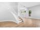 Elegant foyer with a winding staircase, hardwood flooring, and an abundance of natural light at 641 W Oriole Way, Chandler, AZ 85286