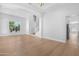Spacious living area showcasing hardwood floors, light walls, and an open layout leading to the staircase and kitchen at 641 W Oriole Way, Chandler, AZ 85286