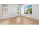 Bright room with hardwood floors and lots of natural light coming through multiple windows at 641 W Oriole Way, Chandler, AZ 85286