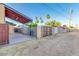 Enclosed backyard with patio, gated entrance, and mature palm trees at 803 W 18Th St, Tempe, AZ 85281
