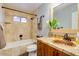 Beautiful bathroom featuring a tub, granite counters, and stylish wood vanity at 803 W 18Th St, Tempe, AZ 85281