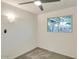 Cozy bedroom with modern ceiling fan, neutral walls, and window allowing natural light at 803 W 18Th St, Tempe, AZ 85281