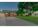 Inviting single-story home featuring manicured lawn, mature shade tree and long private driveway at 803 W 18Th St, Tempe, AZ 85281