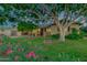 Charming home featuring a mature shade tree with a playful tree swing in a lush front yard at 803 W 18Th St, Tempe, AZ 85281