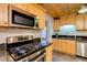 Updated kitchen features stainless steel appliances, granite countertops, and custom cabinets at 803 W 18Th St, Tempe, AZ 85281