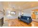 Spacious living room with hardwood floors, a fireplace, and seamless access to the kitchen at 803 W 18Th St, Tempe, AZ 85281