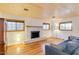 Cozy living room boasts a classic fireplace and hardwood floors, perfect for relaxing at 803 W 18Th St, Tempe, AZ 85281