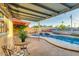 Spacious patio with a covered area and outdoor seating, perfect for enjoying poolside views and outdoor gatherings at 803 W 18Th St, Tempe, AZ 85281