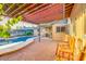 Relaxing covered patio area with pool view, ideal for enjoying the outdoors and entertaining guests at 803 W 18Th St, Tempe, AZ 85281