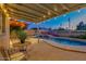 Charming covered patio with poolside views, perfect for relaxing and enjoying outdoor living at 803 W 18Th St, Tempe, AZ 85281