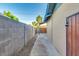 Private side yard with block wall, offering a secure and secluded outdoor space at 803 W 18Th St, Tempe, AZ 85281