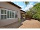 Beautiful backyard featuring desert landscape and direct access to the house via a brick-paved patio at 8934 E Rusty Spur Pl, Scottsdale, AZ 85255