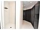 Contemporary bathroom showcasing a marble tiled walk-in shower and a custom closet at 8934 E Rusty Spur Pl, Scottsdale, AZ 85255