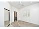 Bedroom with wood-look floors, recessed lighting, and a mirrored closet at 8934 E Rusty Spur Pl, Scottsdale, AZ 85255