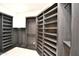 Spacious walk-in closet with custom shelving and ample storage solutions at 8934 E Rusty Spur Pl, Scottsdale, AZ 85255