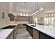 Spacious kitchen with stainless steel appliances, large island, and an abundance of natural light at 8934 E Rusty Spur Pl, Scottsdale, AZ 85255