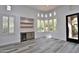 Bright living space with large windows, a wet bar with beverage cooler, and stylish wood-look floors at 8934 E Rusty Spur Pl, Scottsdale, AZ 85255
