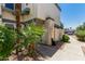 Landscaped exterior view showing the side of the home and walkway to the unit at 9047 N 52Nd Ave, Glendale, AZ 85302