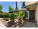 Charming front entrance with desert landscaping and a secure, decorative gate at 9047 N 52Nd Ave, Glendale, AZ 85302
