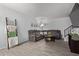 Comfortable living room with a sectional sofa, decorative accents, and staircase at 9047 N 52Nd Ave, Glendale, AZ 85302