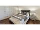 Modern bedroom with custom wardrobe, dark wood floors, and luxurious decor for a serene retreat at 9280 E Davenport Dr, Scottsdale, AZ 85260