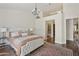 Charming main bedroom offers an ensuite bathroom, hardwood floors and great natural light at 9280 E Davenport Dr, Scottsdale, AZ 85260