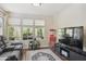 Comfortable bonus room with media center, hardwood floors, and natural light at 9280 E Davenport Dr, Scottsdale, AZ 85260