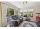 Bright bonus room with a comfortable couch and direct access to the patio at 9280 E Davenport Dr, Scottsdale, AZ 85260