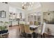 Open dining area showcases stylish lighting and seamlessly connects to the well-lit kitchen at 9280 E Davenport Dr, Scottsdale, AZ 85260