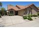 Beautiful single-story home with desert landscaping, a two car garage, and welcoming curb appeal at 9280 E Davenport Dr, Scottsdale, AZ 85260