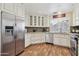 The bright kitchen features white cabinets, stainless steel appliances, and granite countertops at 9280 E Davenport Dr, Scottsdale, AZ 85260