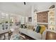 Relaxing living space with built-in shelving, hardwood floors and access to another living area at 9280 E Davenport Dr, Scottsdale, AZ 85260