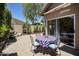 Enjoy the charming paver patio with an outdoor dining set, perfect for entertaining or relaxing outdoors at 9280 E Davenport Dr, Scottsdale, AZ 85260